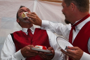 Us enjoying the wedding cake